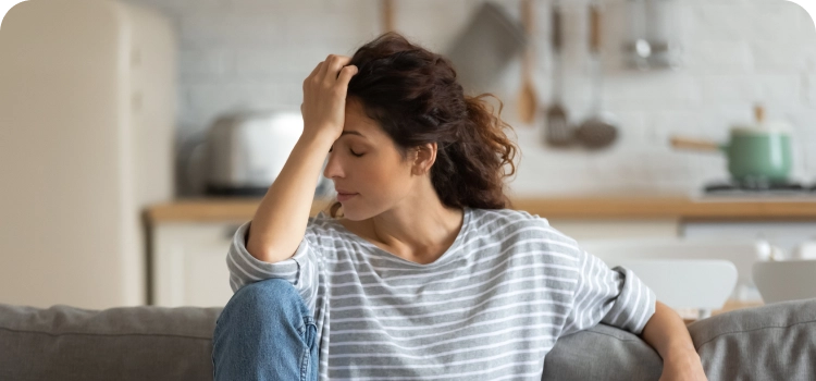 Photo of a woman with migraine