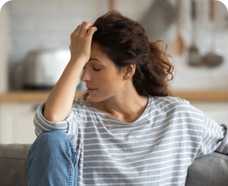 Photo of a woman with migraine